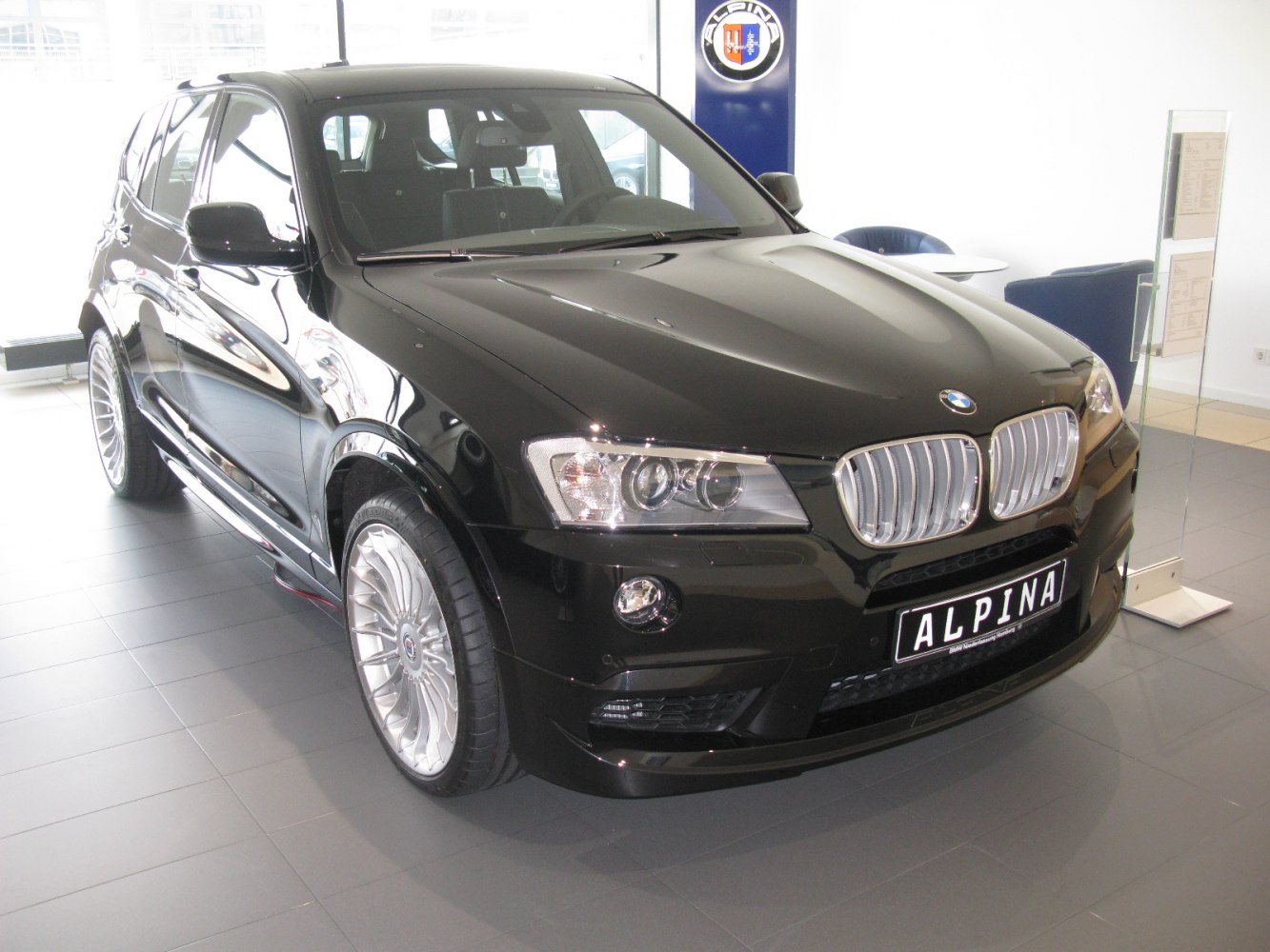 Black luxury SUV with kidney grille and multi-spoke wheels
