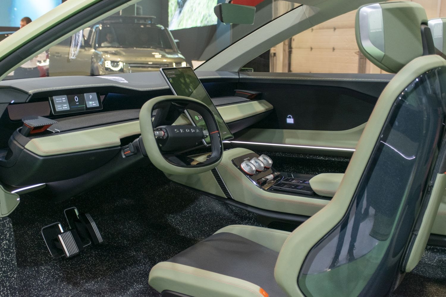 Futuristic car interior with unique steering wheel and digital dashboard