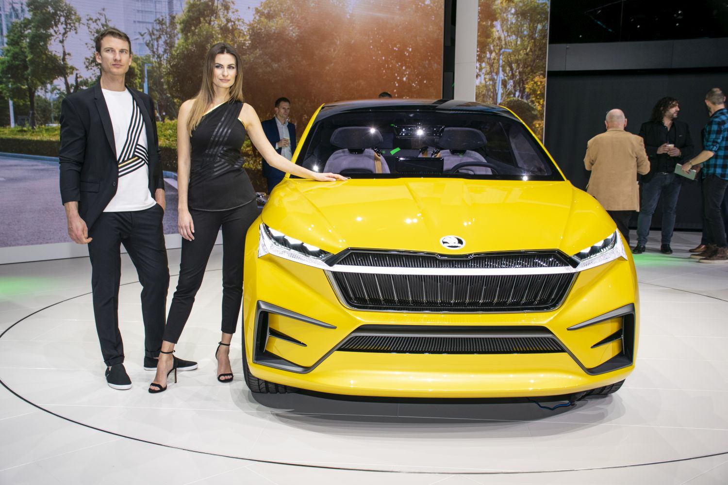 Yellow electric SUV front view with LED headlights and bold grille.