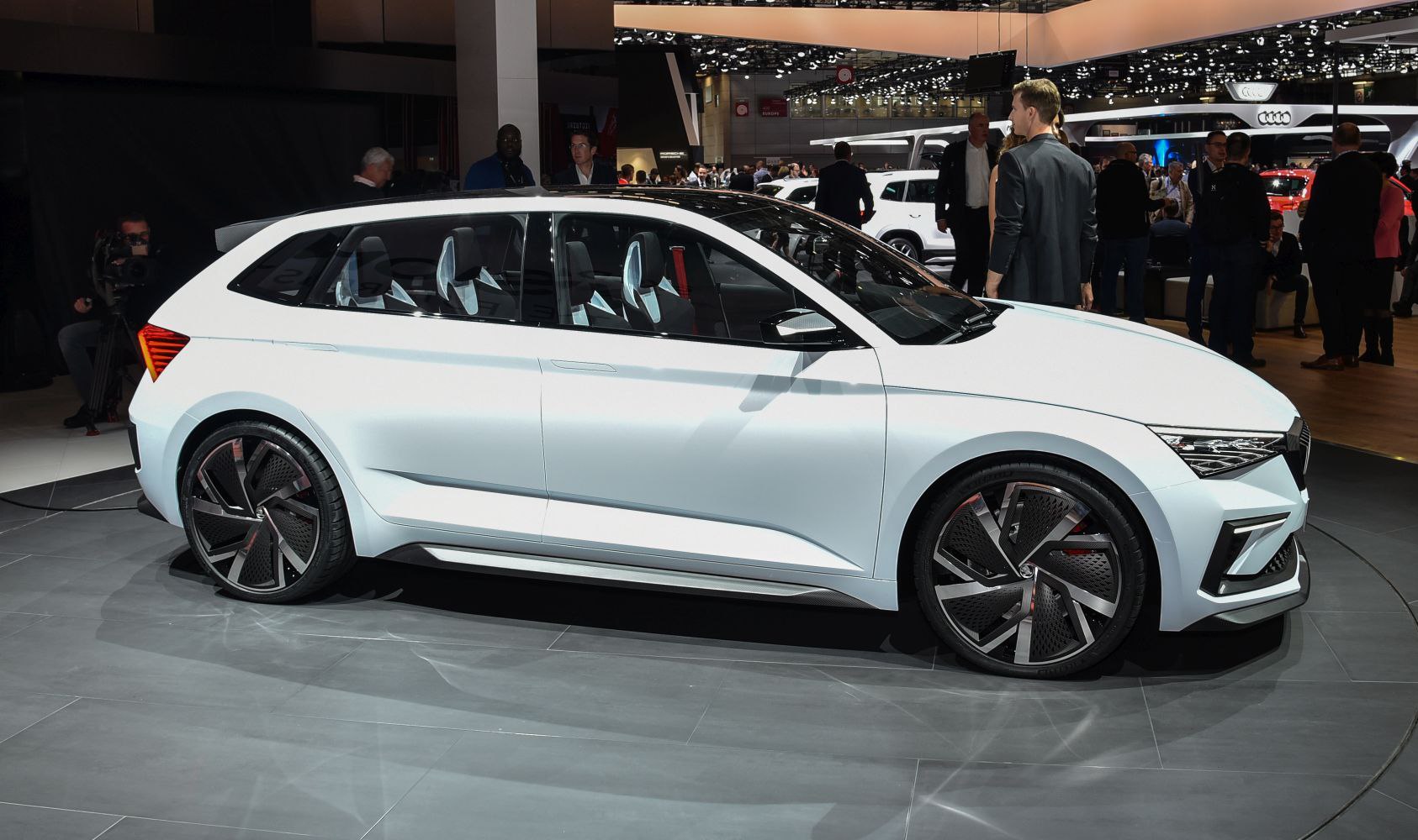 Sleek side profile with futuristic large alloy wheels and aerodynamic shape