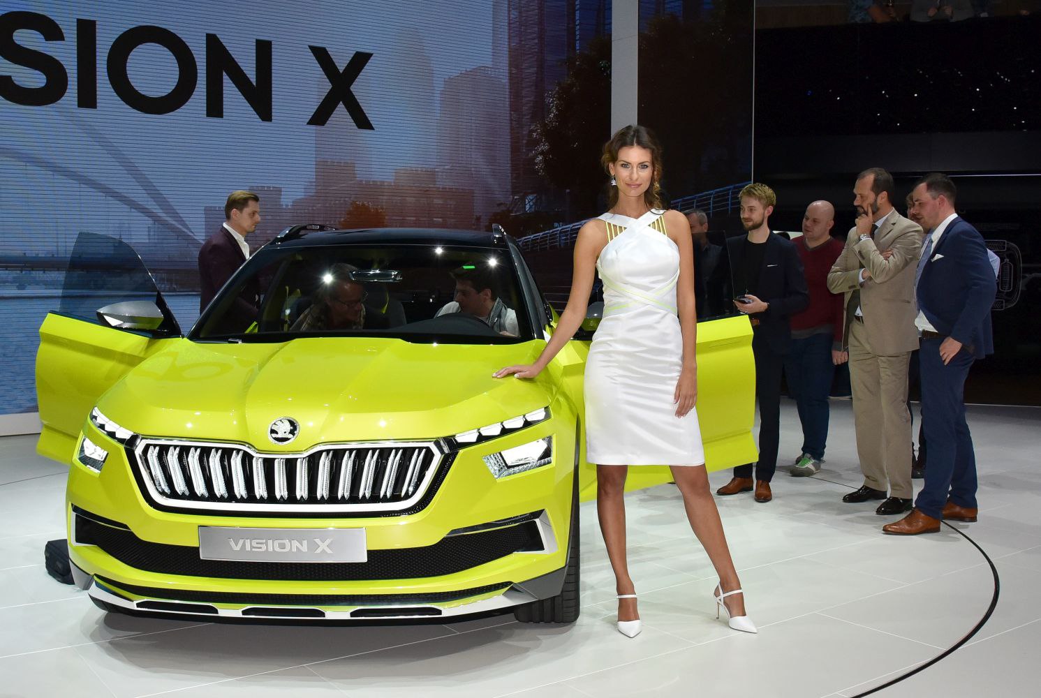 Bright yellow front view with LED headlights and grille design
