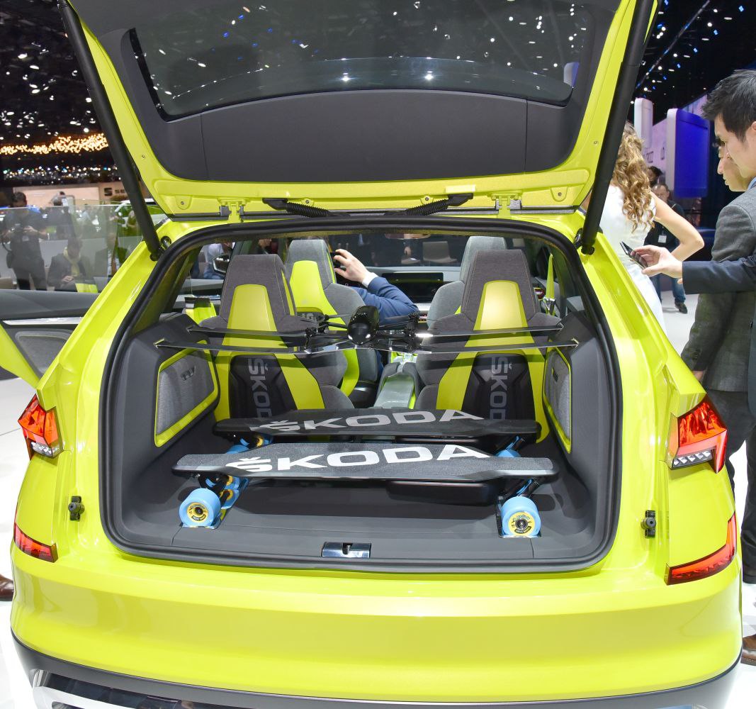 Open rear hatch with cargo space holding skateboards and sporty two-tone seats inside