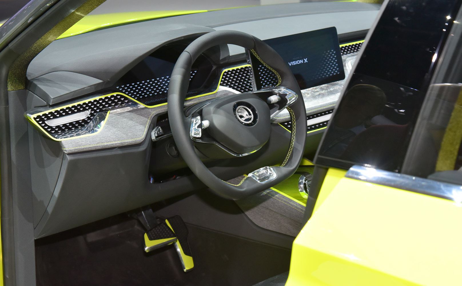 Futuristic car interior with digital displays and modern steering wheel