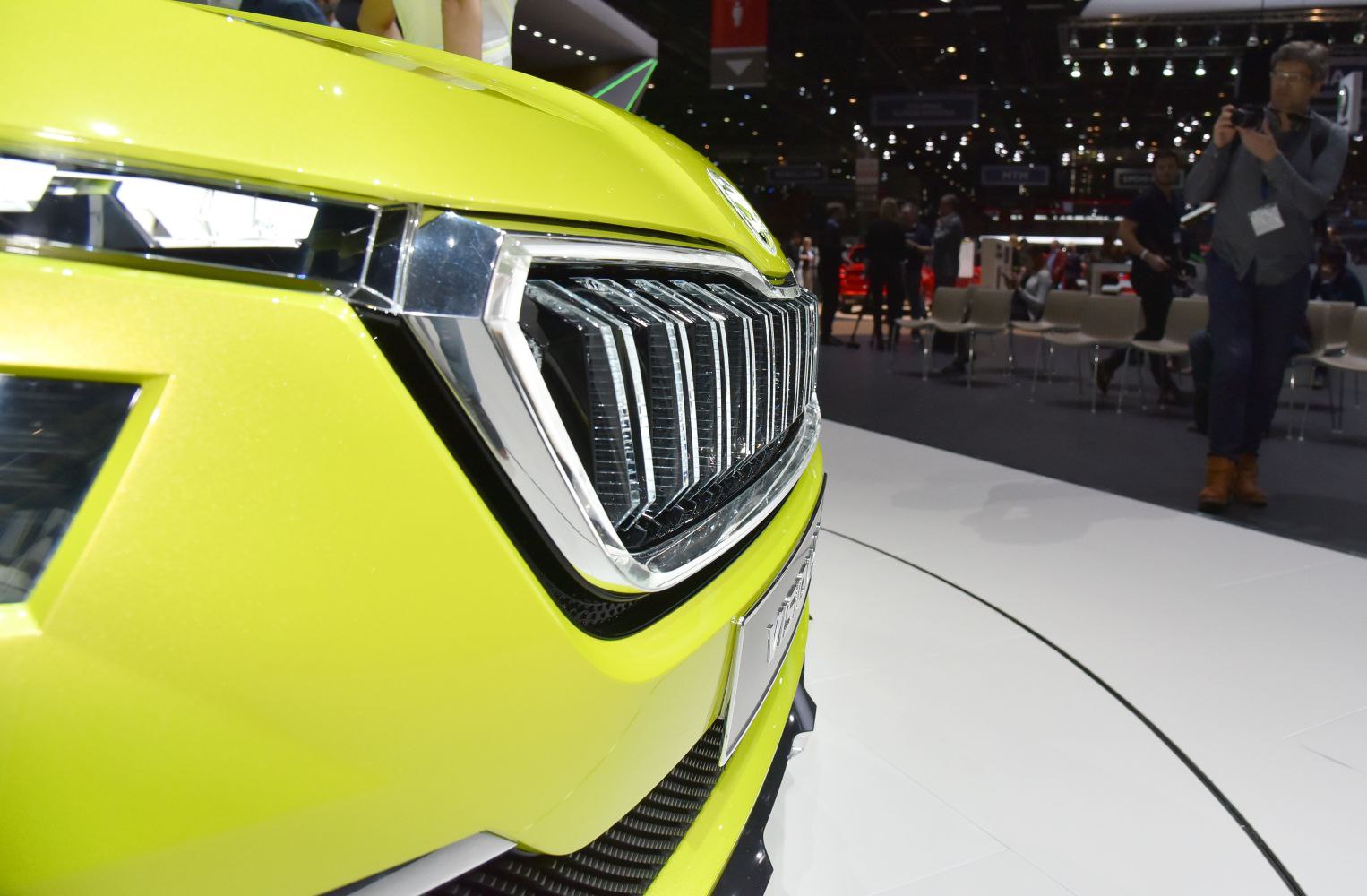 Close-up of front grille and headlight with vertical chrome slats