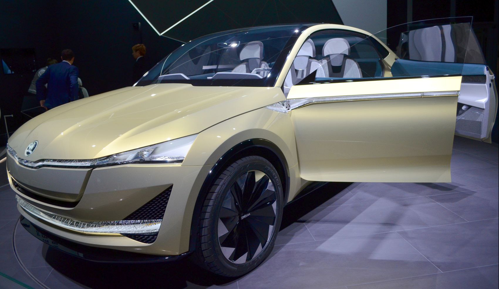 Futuristic electric SUV front with LED headlights and open door