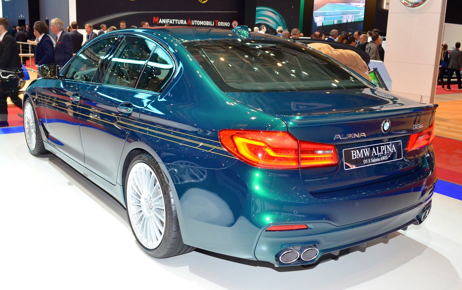 Rear view of luxury sedan with quad exhaust and Alpina striping