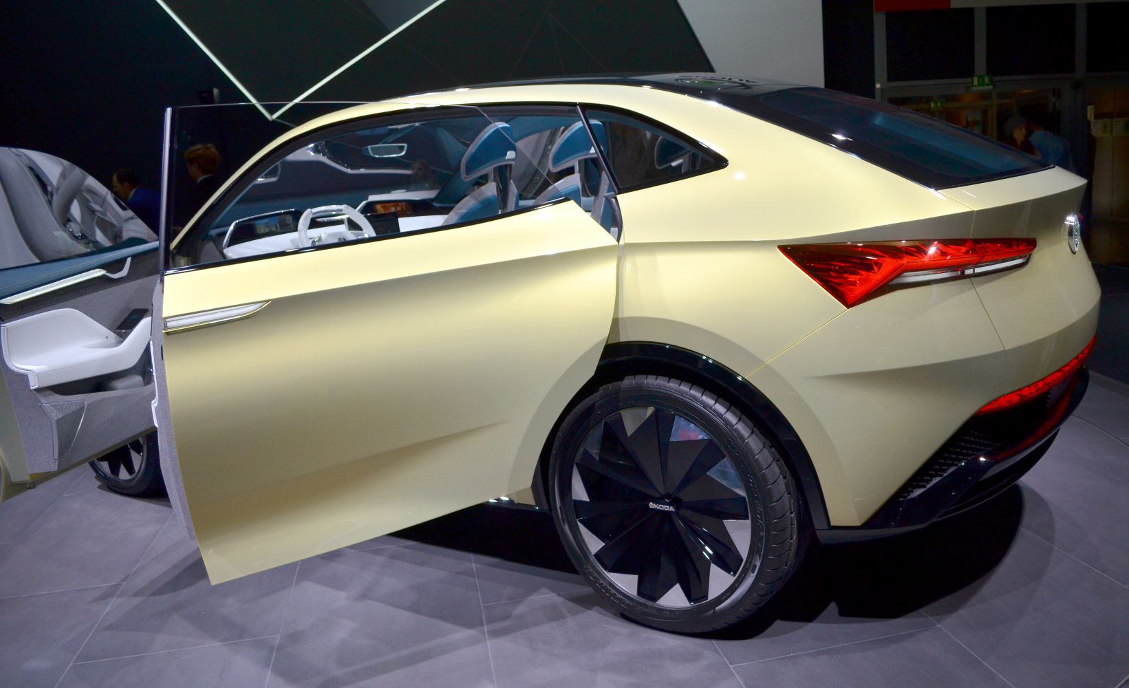 Rear side with open door and futuristic geometric wheel
