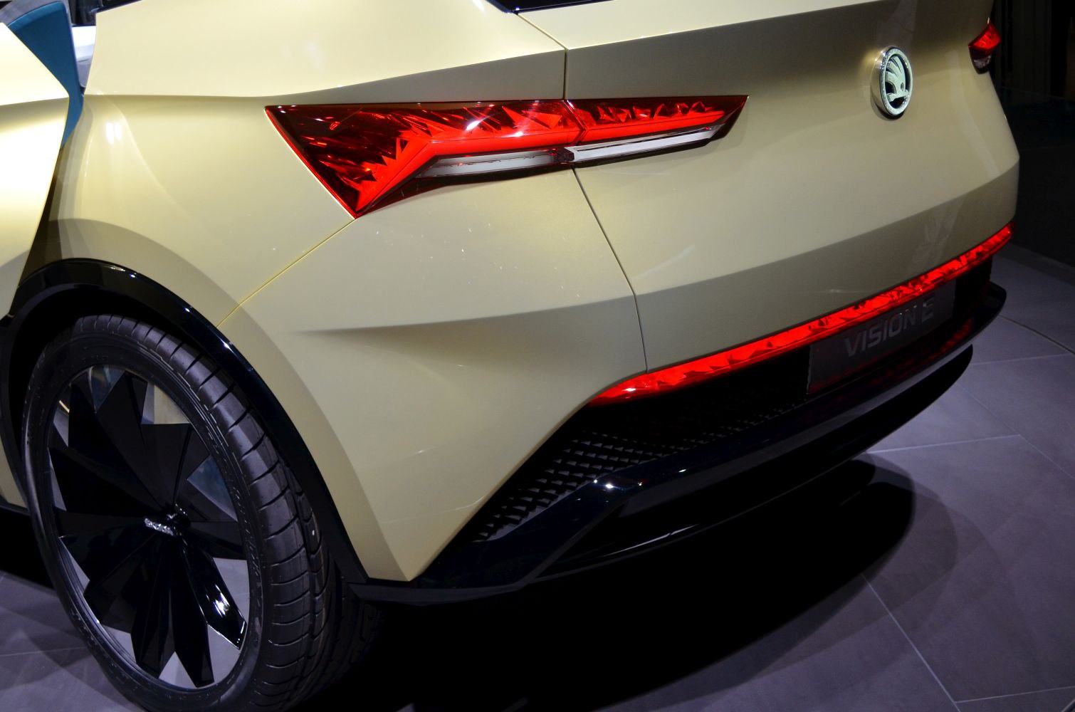 Geometric rear design with sharp taillights and black wheel.
