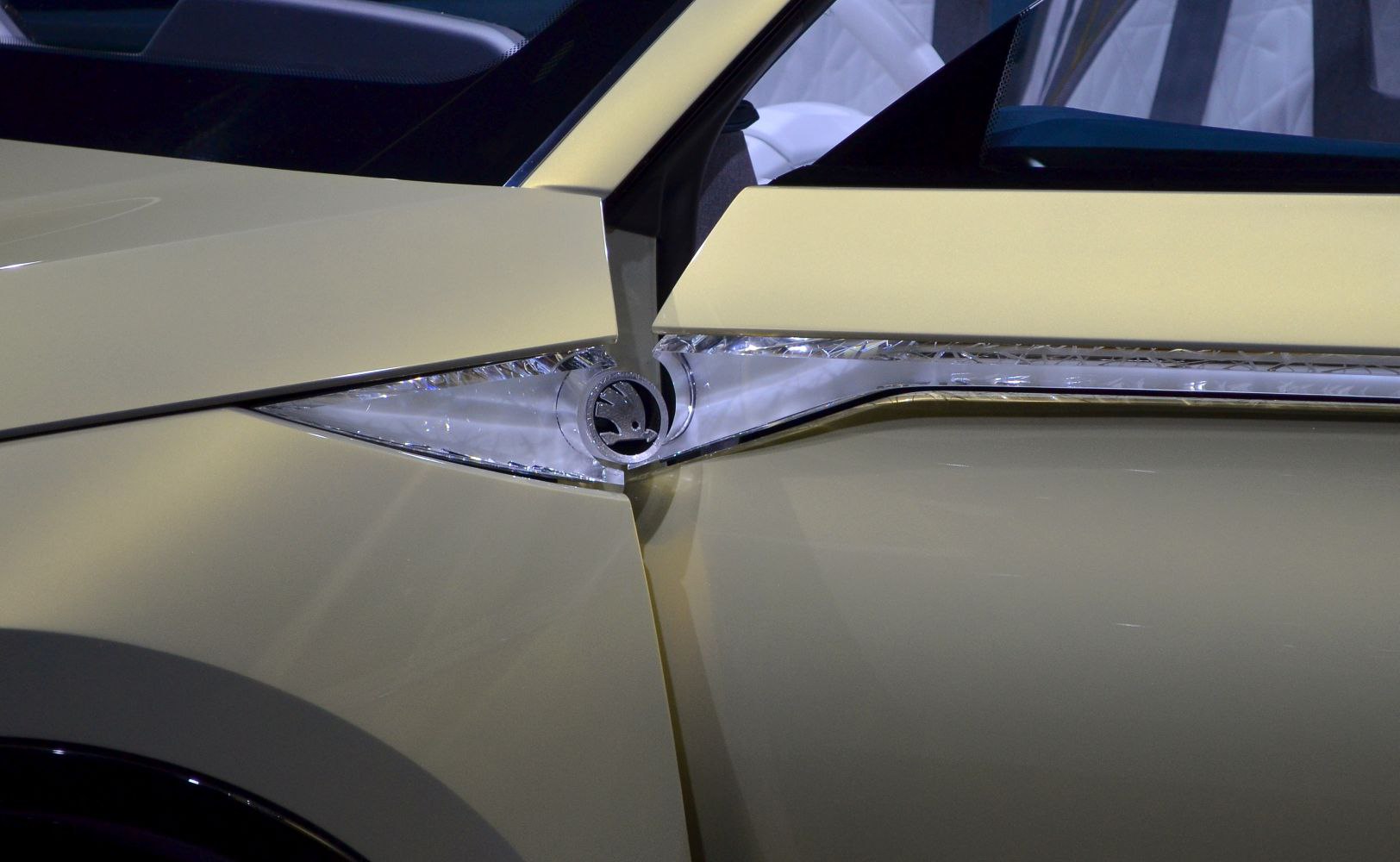 Close-up of front side LED light and sleek body panel detail