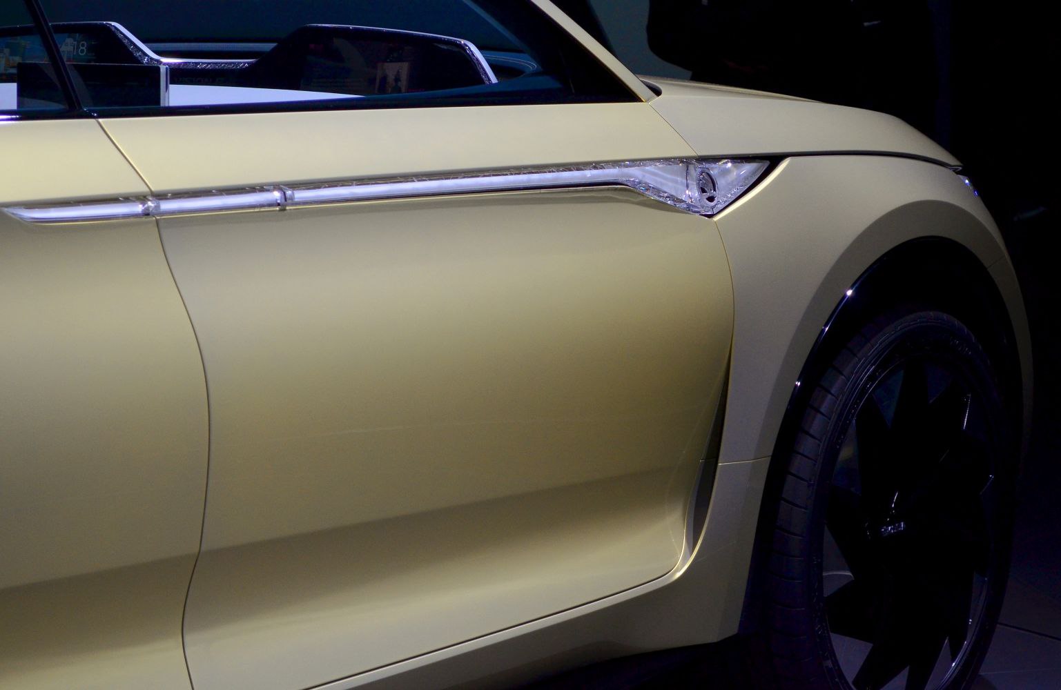Close-up of sleek side panel with integrated LED strip and modern wheel arch