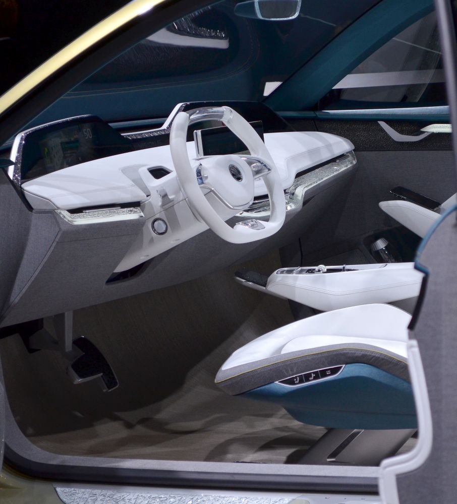 White futuristic dashboard and unique steering wheel design