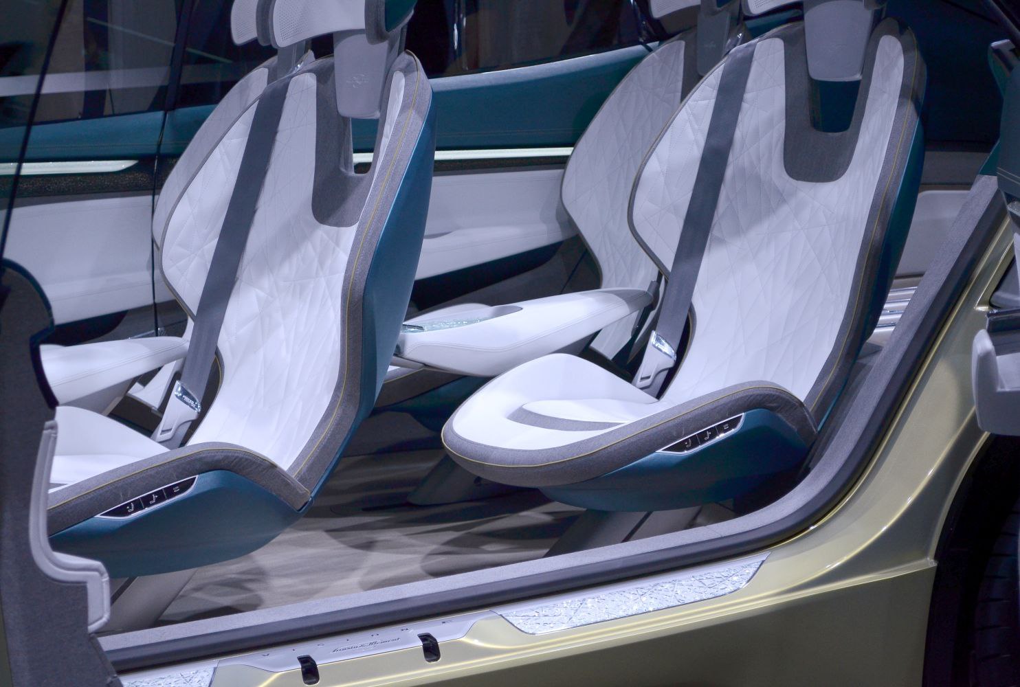 Futuristic white and blue car interior seats with sleek design and integrated controls