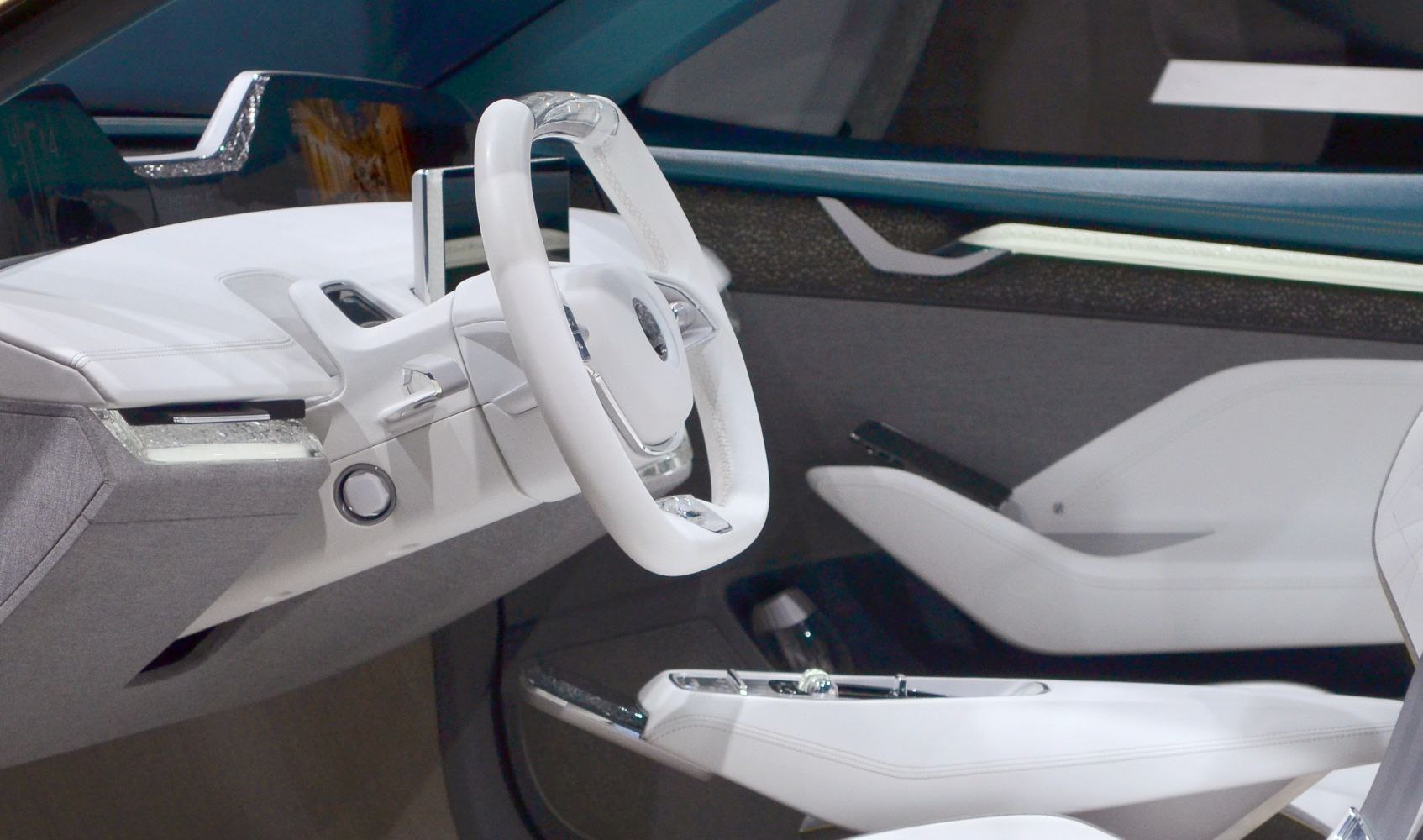 White futuristic steering wheel and modern minimalist dashboard
