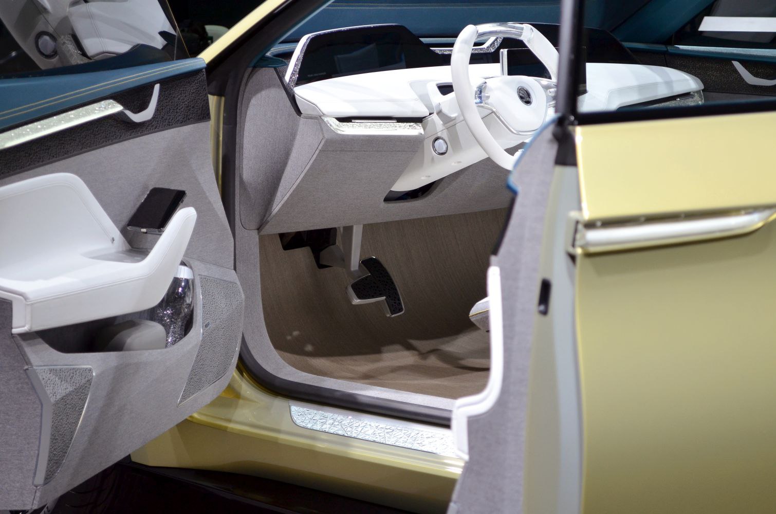 Futuristic car interior with unique steering wheel and door panel design