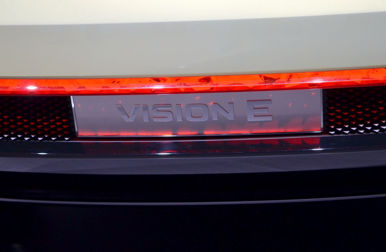 Close-up of rear illuminated light strip and Vision E emblem