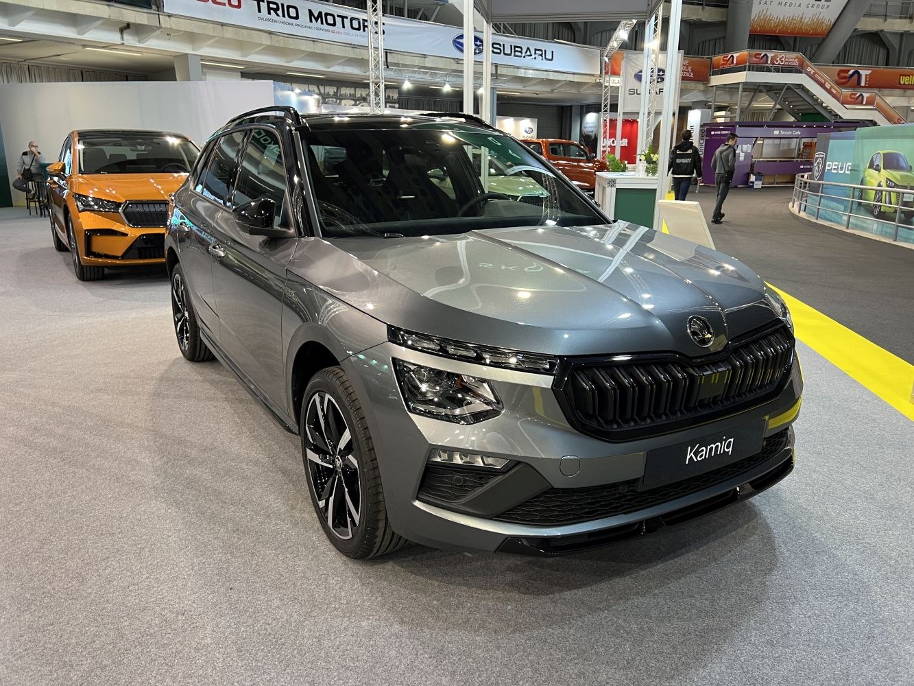 Front and side view of the compact SUV with updated grille and LED headlights.