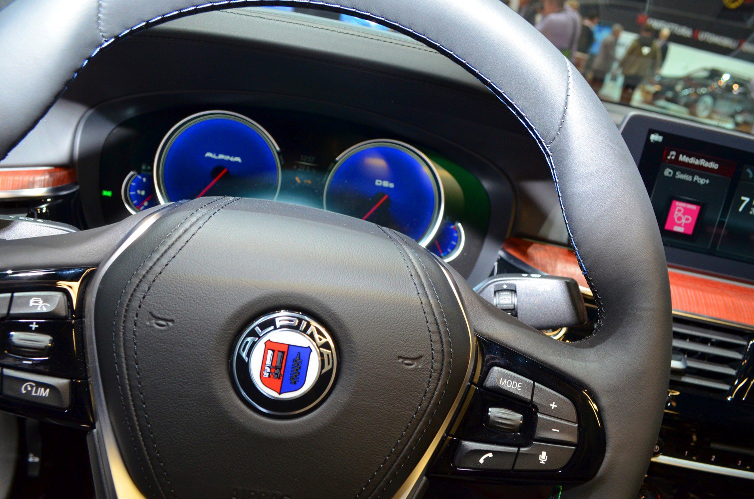 Blue dial instrument cluster and leather steering wheel with controls