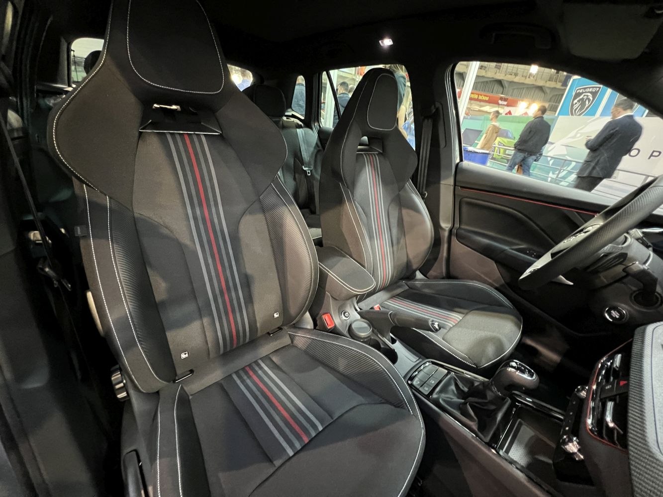 Sporty front seats with stripe detailing in a modern car interior