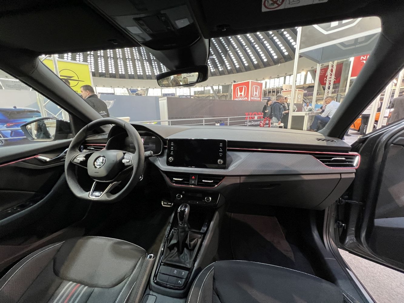 Digital dashboard, touchscreen infotainment, modern steering wheel interior