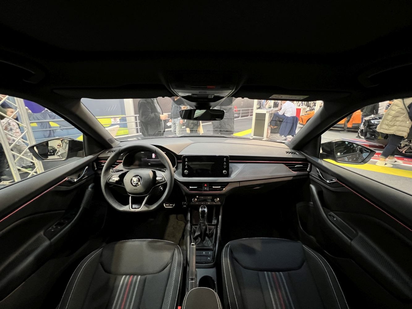 Modern dashboard and front seating with touchscreen and ambient lighting
