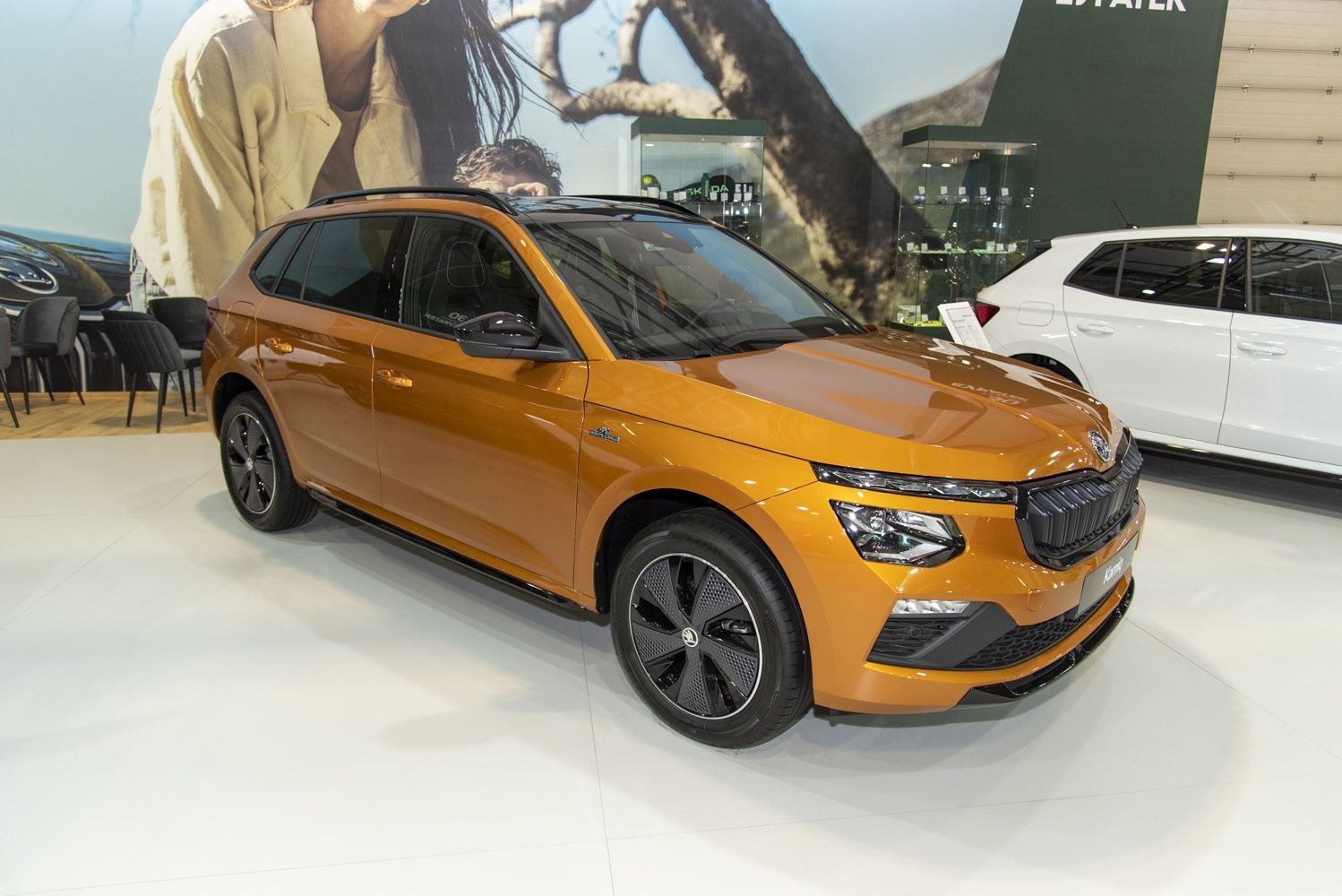 Front-side view with LED headlights and distinctive black alloy wheels