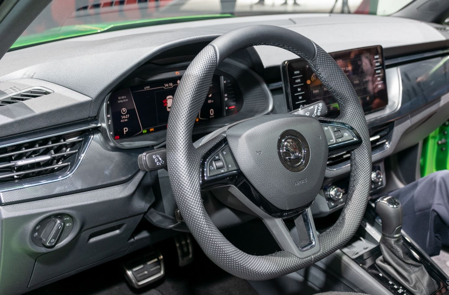 Digital dashboard and multifunction steering wheel in a modern car interior