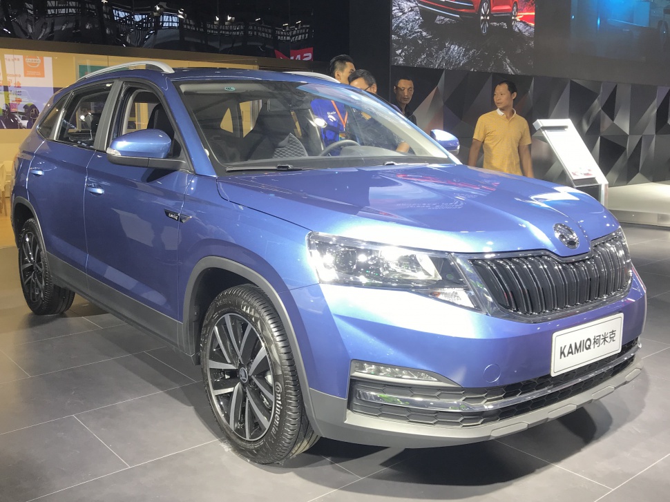 Compact SUV front view with bold grille and alloy wheels.