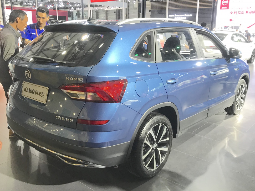 Rear side view showcasing tail lights and alloy wheels