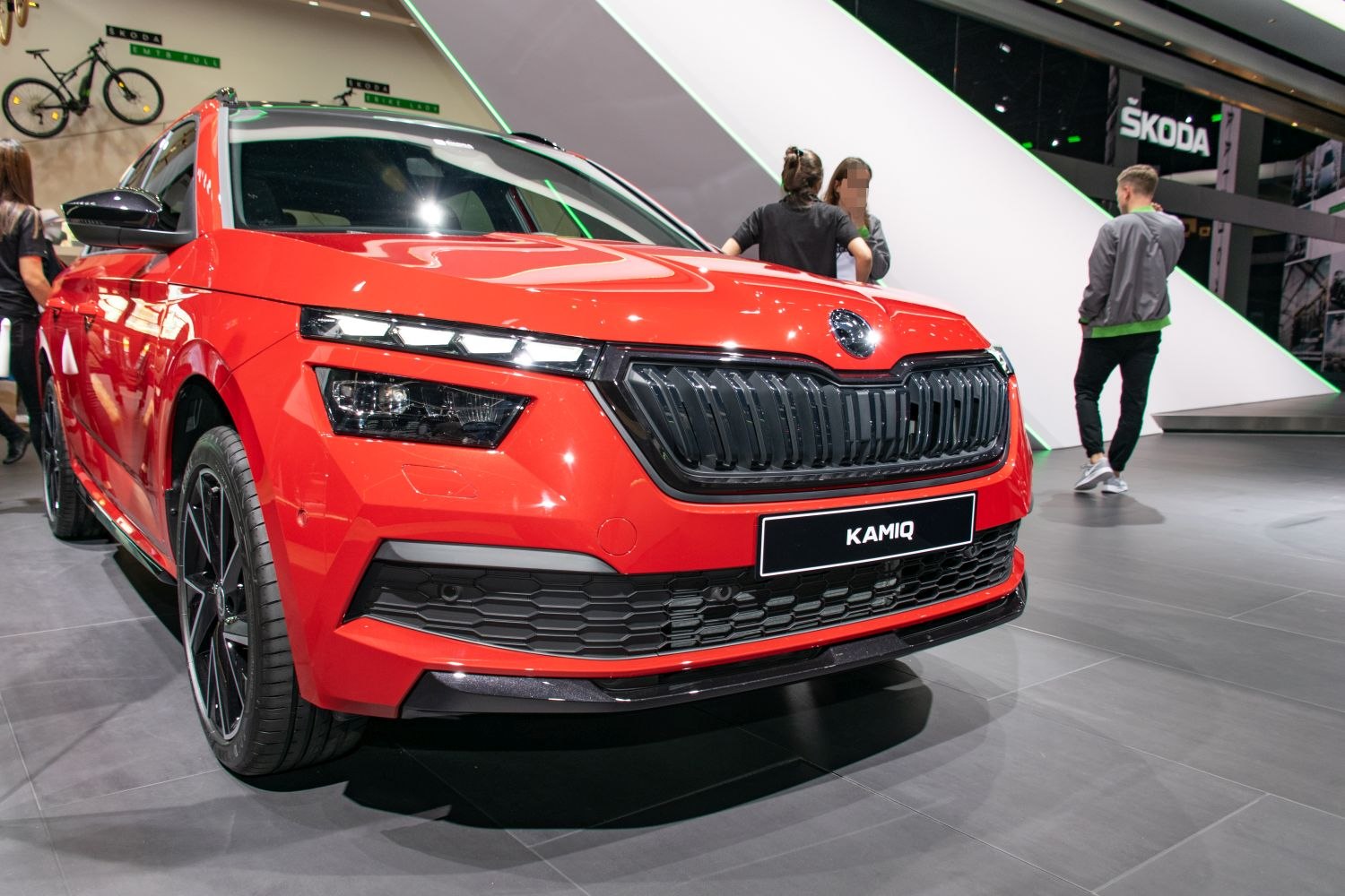 Sharp LED headlights and bold black grille on a front view.