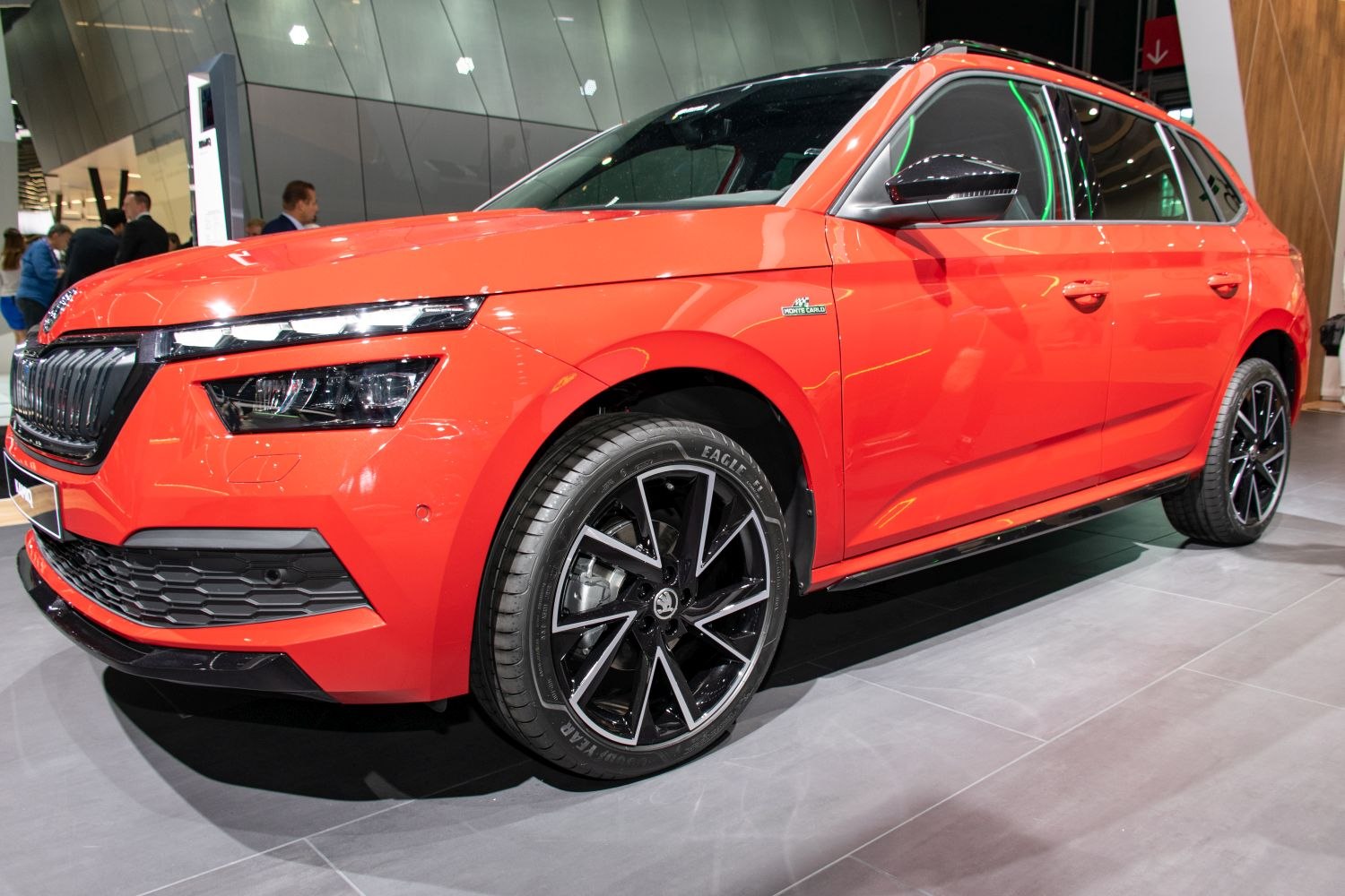 Front-side view of SUV with sharp headlights and black alloy wheels
