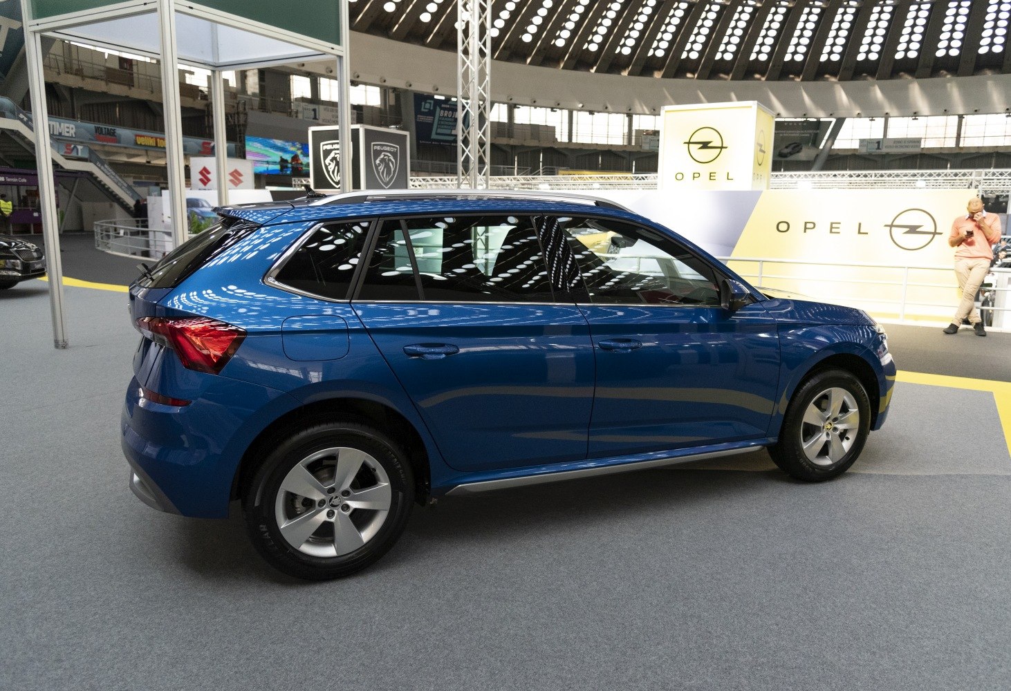 Blue five-door compact SUV side profile with alloy wheels
