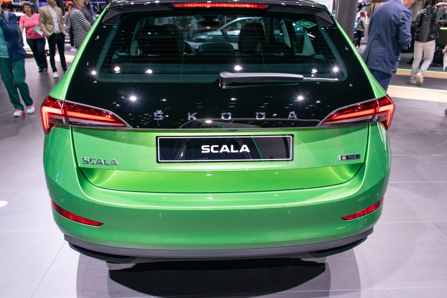 Rear view with distinctive taillights and GT TEC badge on a green hatchback