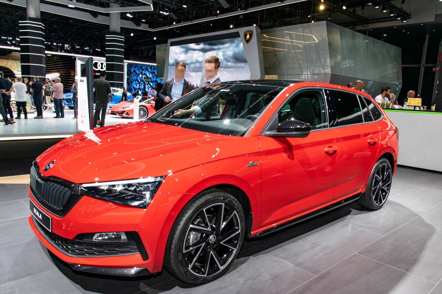 Red hatchback with LED headlights and sporty alloy wheels