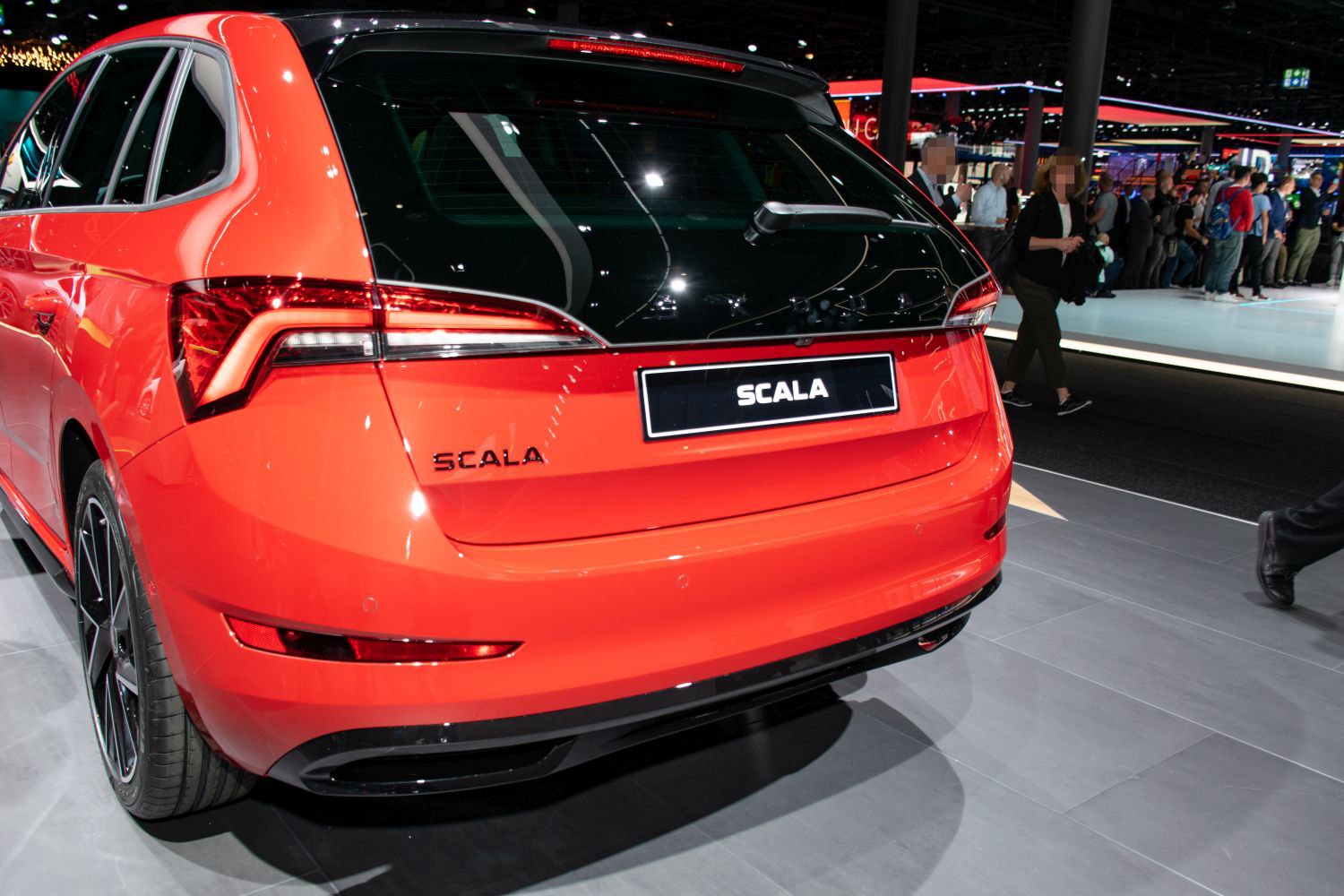 Rear view with distinct tail light and hatchback design