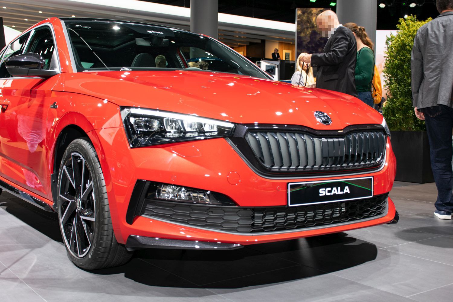 Front view with LED headlights and black grille of a modern hatchback