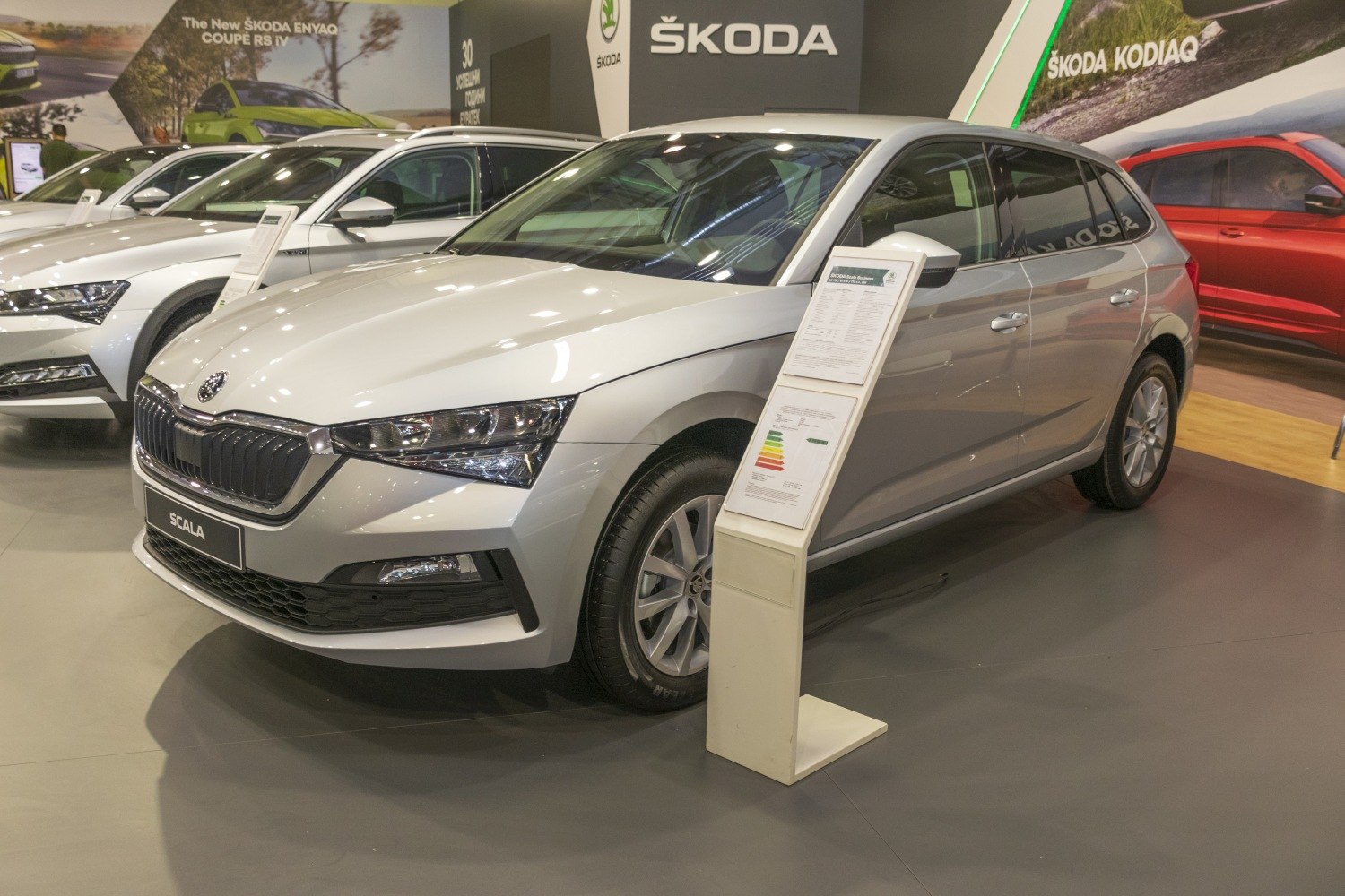 Silver hatchback with sleek headlights and bold grille