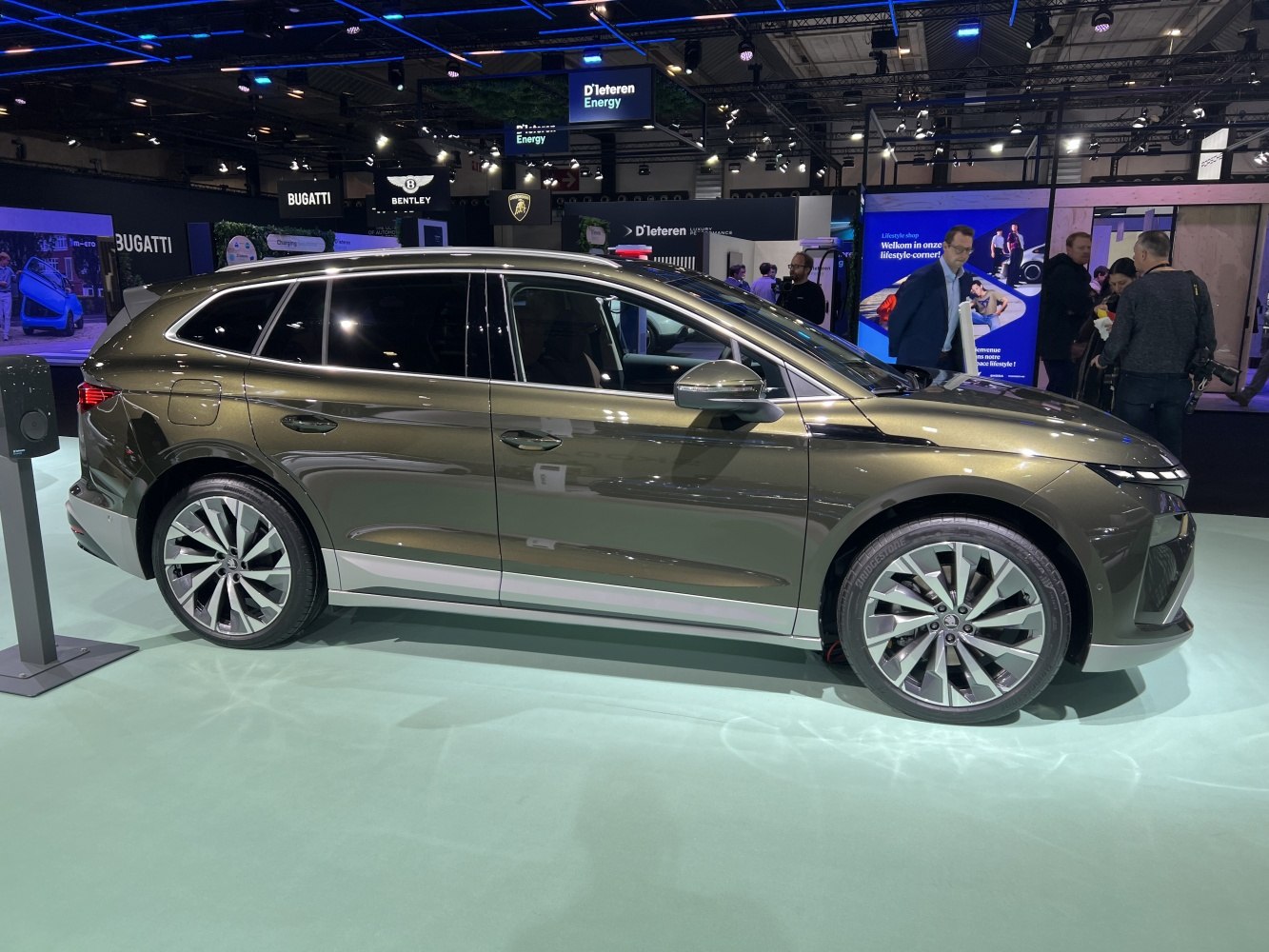 Side view of sleek electric SUV with modern alloy wheels