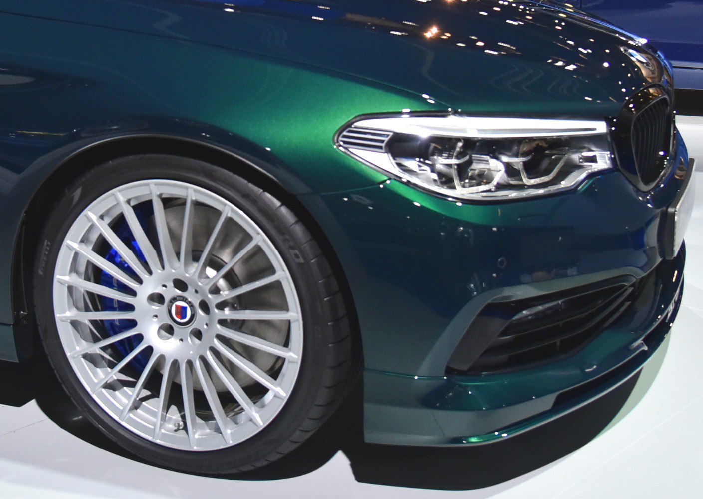 Front alloy wheel with multi-spoke design and modern LED headlight.