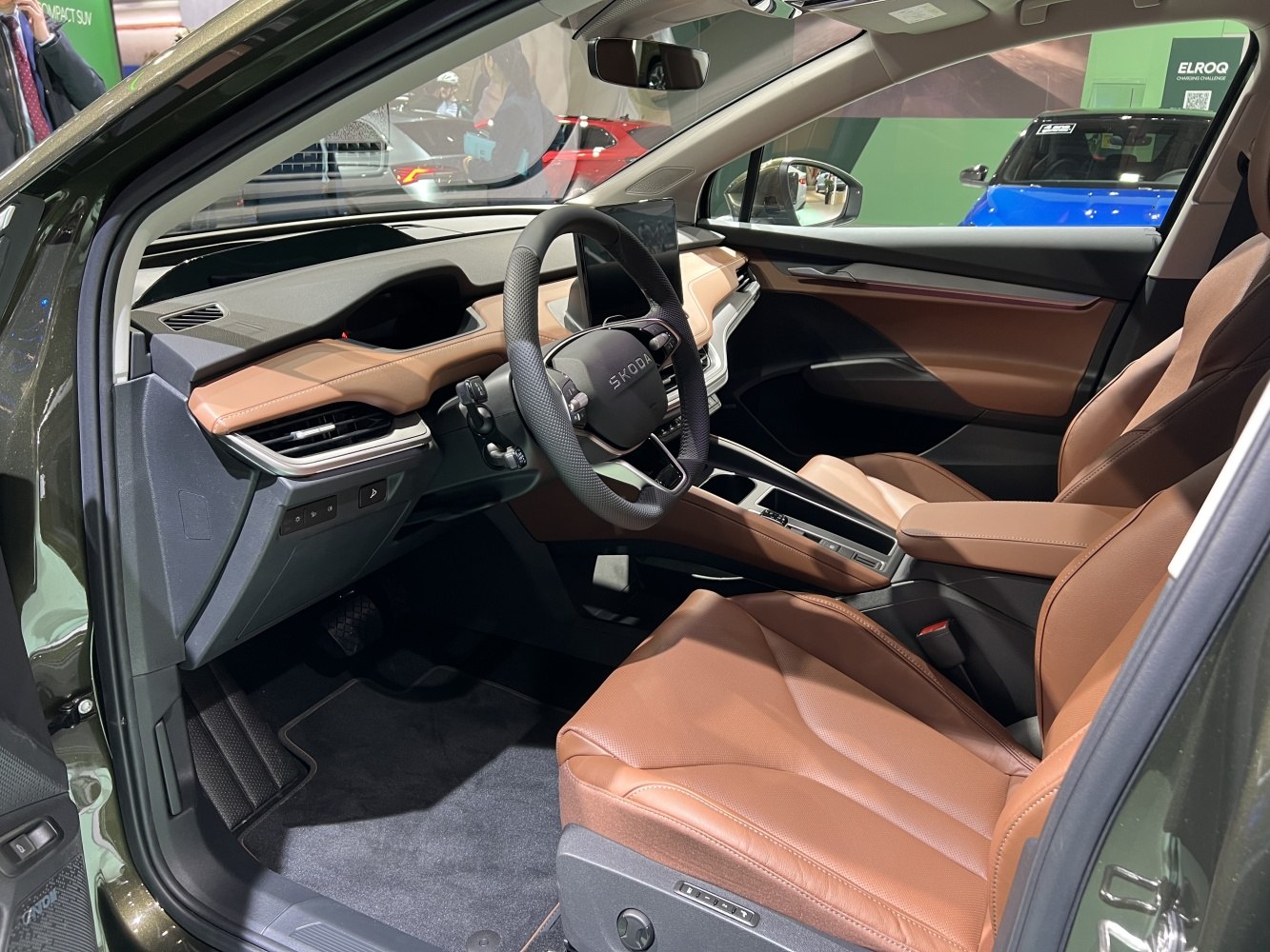 Brown leather seats and digital dashboard in modern ergonomic cabin