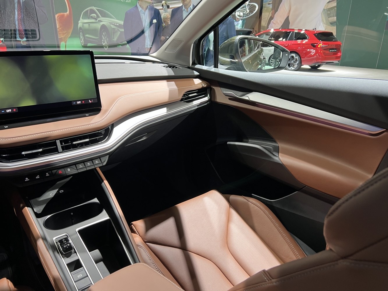 Modern dashboard and brown leather seats in vehicle interior