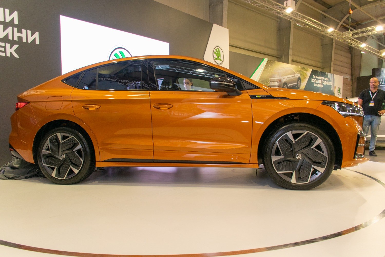 Side profile of a sleek coupe SUV with distinctive wheel rims