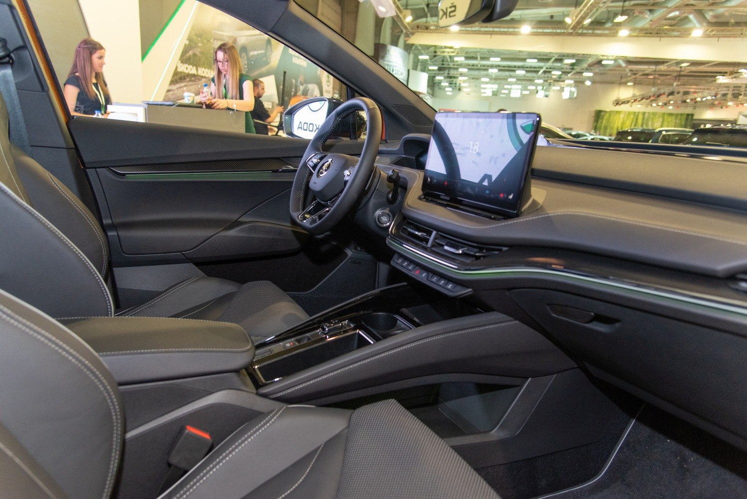 Electric SUV interior with digital dashboard and multifunction steering wheel