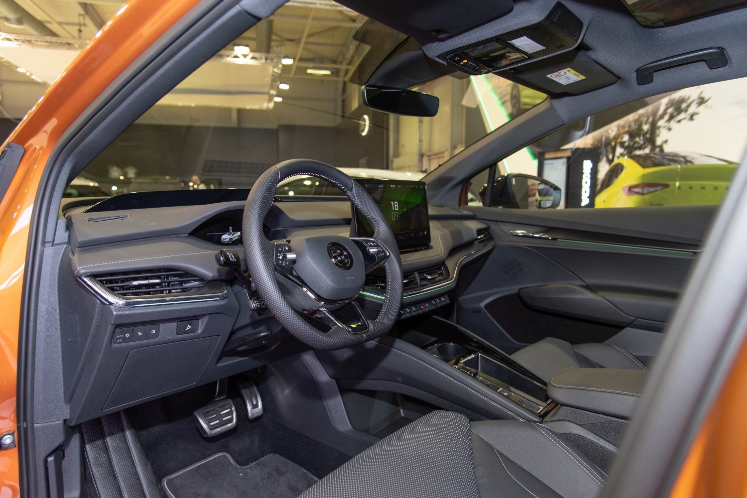 Modern digital dashboard and multifunction steering wheel in car interior