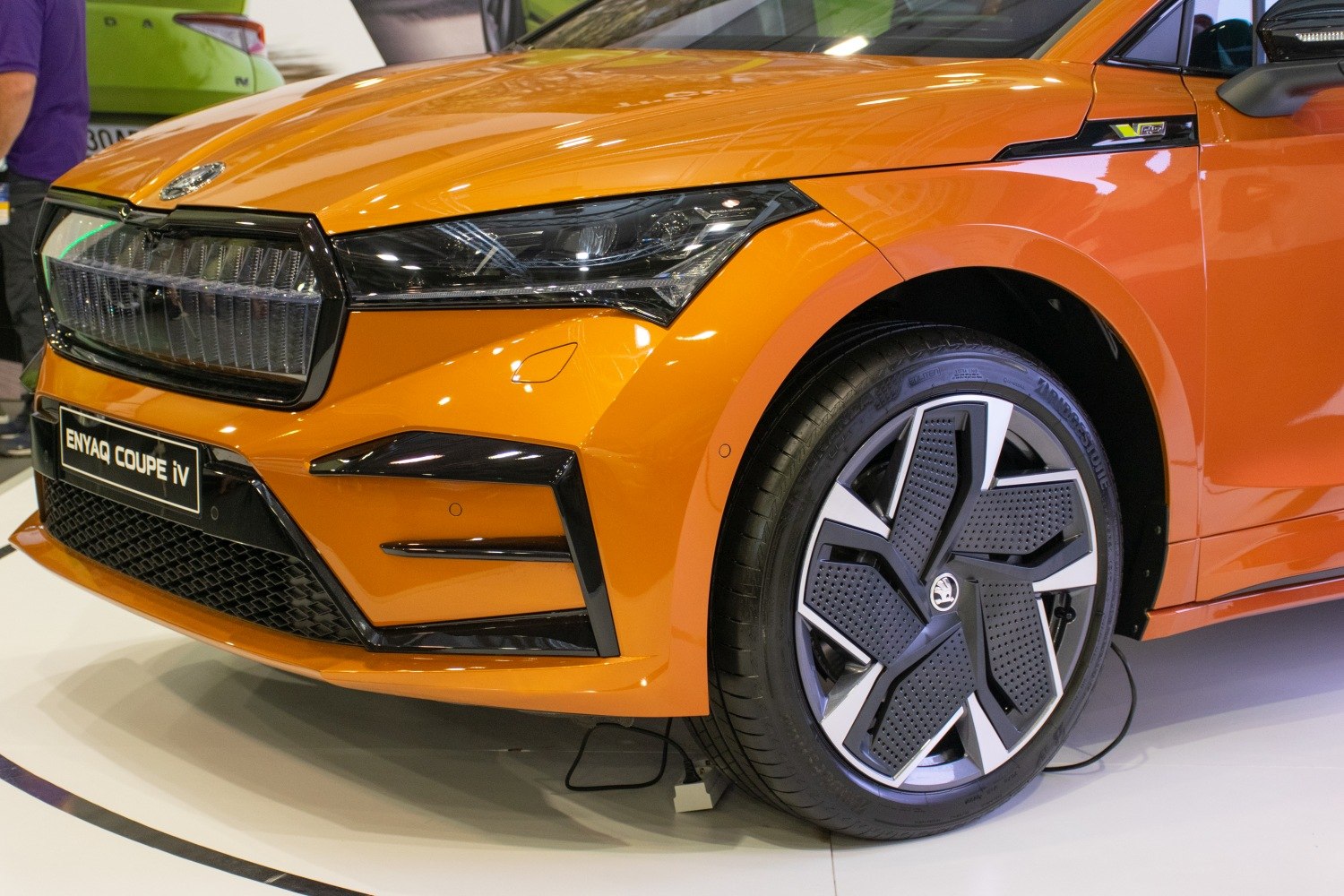 Front headlight and alloy wheel close-up