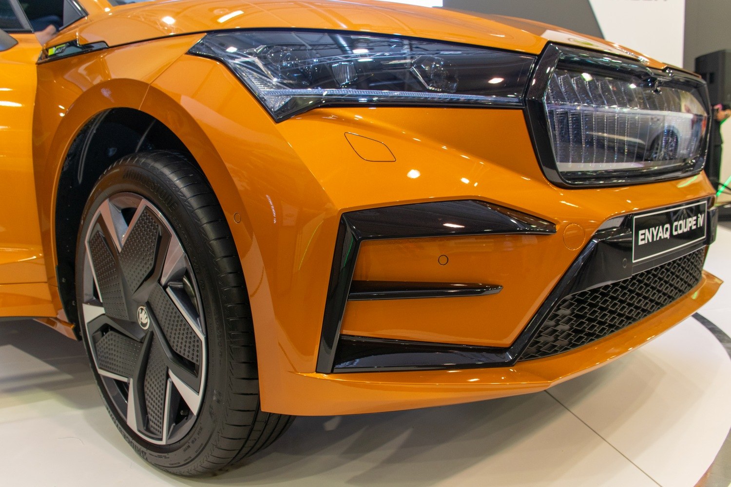Front headlight and alloy wheel close-up with modern design