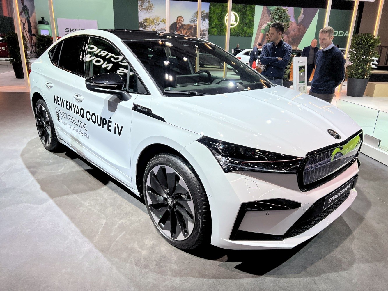 Front and side view of electric coupe SUV with aerodynamic design