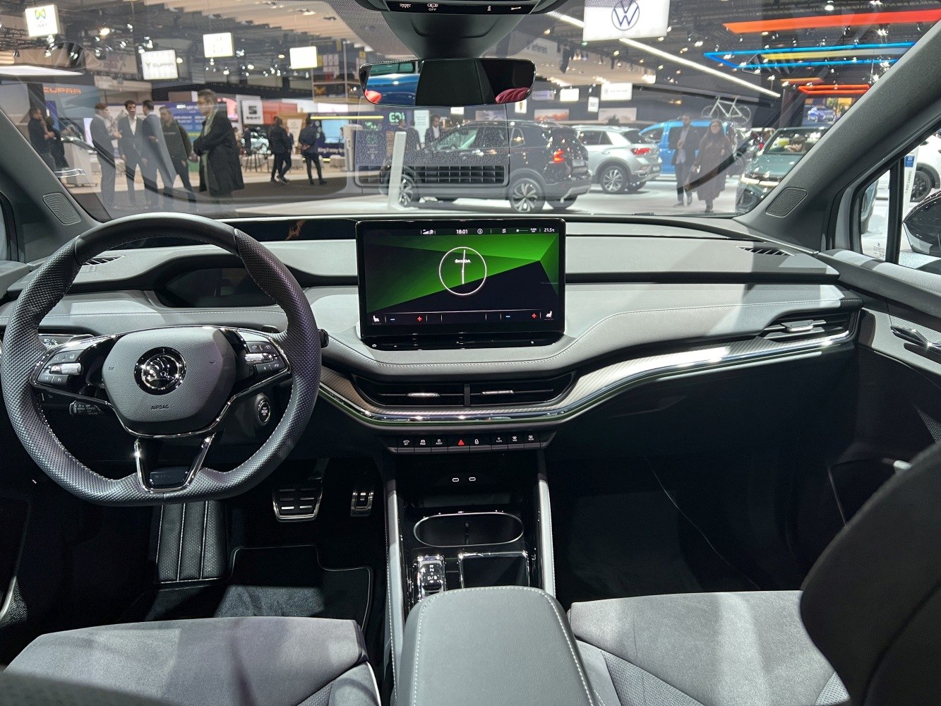 Digital dashboard and touchscreen infotainment center with steering wheel controls