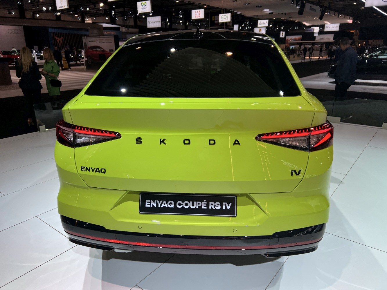 Rear view of a sleek modern SUV with distinctive LED taillights and electric vehicle badges.