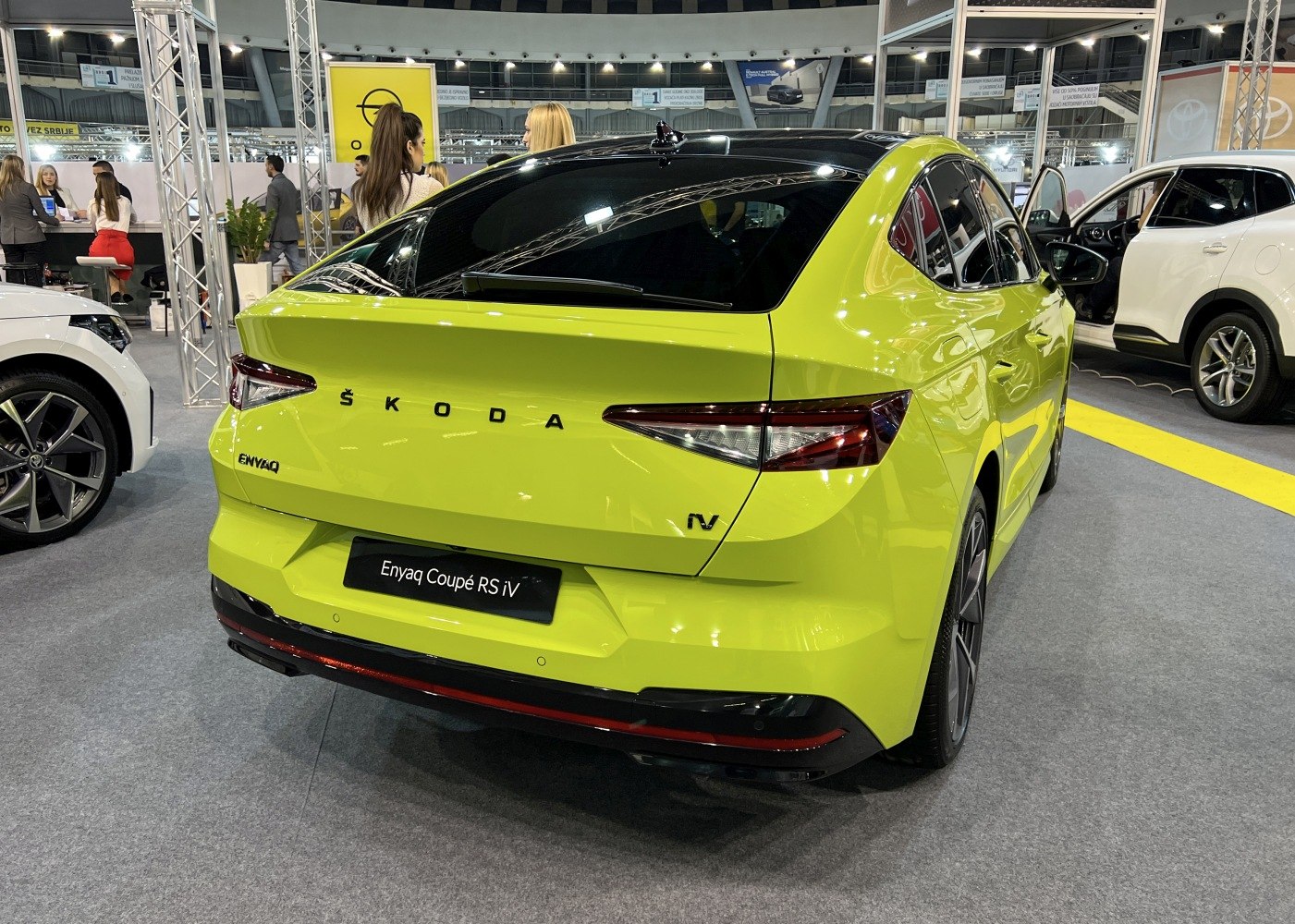 Sleek rear view of electric SUV with sharp taillights and integrated spoiler