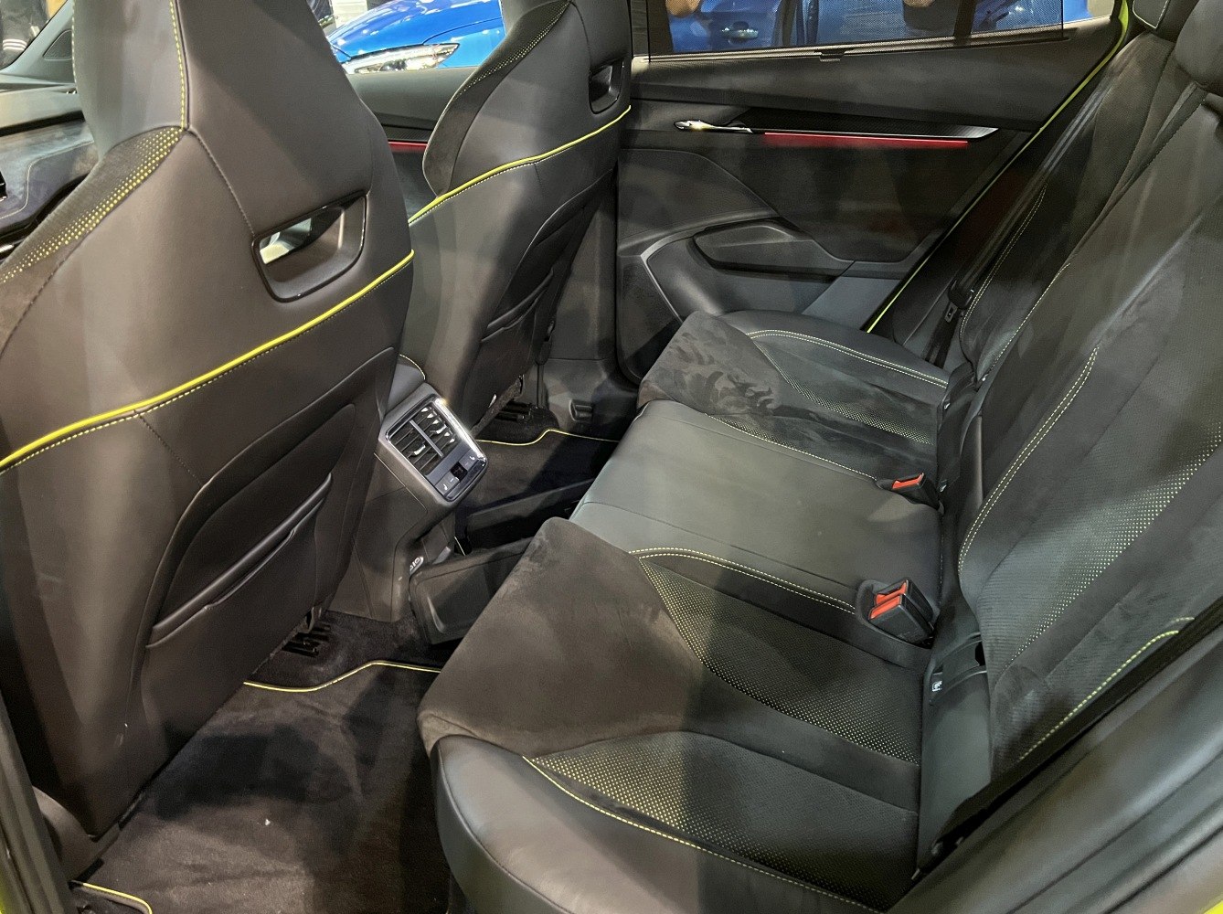 Rear seat interior with leather and fabric upholstery and rear AC vents